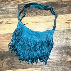 Brand new turquoise faux suede fringe purse